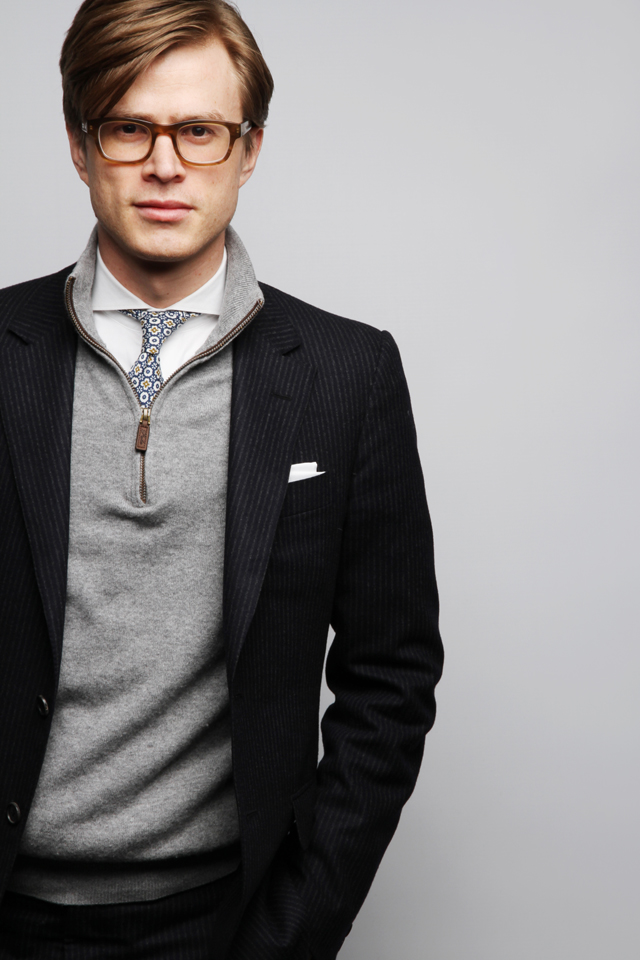 Casual business portrait of a man wearing glasses.